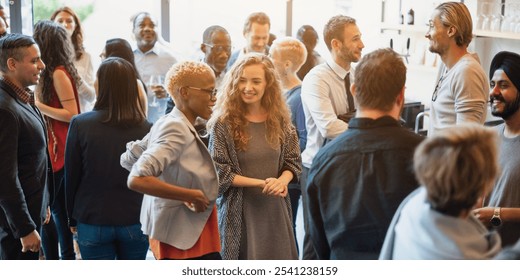 Diverse group of people socializing at a casual gathering. Men and women of various ethnicities engaged in conversation, enjoying a lively social event. Diverse people mingle at a social event.