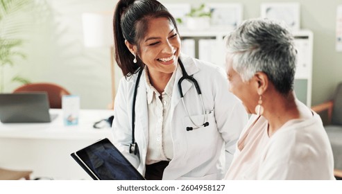 Mature woman, doctor and tablet for xray, support or conversation with cardiology checkup in office. Female person, medical professional and diagnosis talk for senior patient at clinic appointment