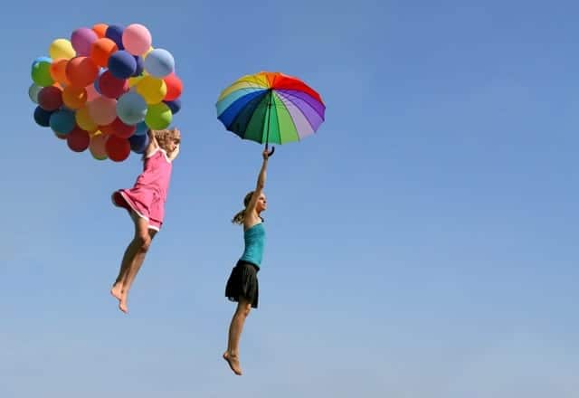 The 60 Most Downloaded Images in 2018 from Top Stock Photo Agencies Compared Freedom Fun Women Flying Balloons Umbrella