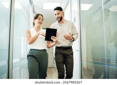 Tablet, business people and walking in office, advice and conversation with creativity. Employees, research and journalist with review for article, tech or feedback with help, smile or online reading